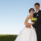 side view of a bride and groom holding each other at the entrance to the church