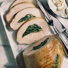 Raw chicken breast fillets on wooden background