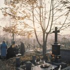 People at burial plot in cemetery