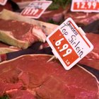 Top loin steaks on cutting board, high angle view, close up