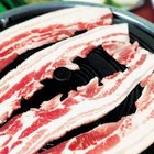 Marinated tuna steak on grill rack