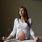 Relax pregnant woman meditating at home