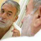 Man combing hair in mirror