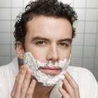 Directly Above Shot Of Shaving Brush And Razor On Marble Floor