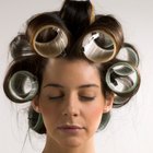 low angle view of a mother putting curlers in her daughter's hair