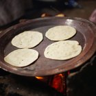 Stack of Homemade Tortillas on floured surface