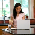 Woman with laptop on couch