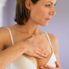 A woman feeling her swollen breast