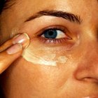 Woman using moisturizing cream