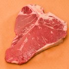 Top loin steaks on cutting board, high angle view, close up