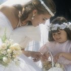 Bride and groom kissing, wedding guests applauding