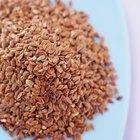 Flax seeds linseed in bowl on wooden table