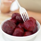 White potatoes in a bowl on a wood table top