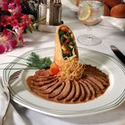 Roast duck with potato dumplings and white cabbage