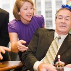 Girl (9-11) at birthday party, leaning over birthday cake, portrait