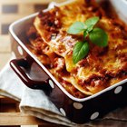 classic vegetarian lasagna on a gray stone background