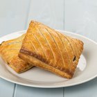 Cuban sandwich on a cutting board on a wooden table