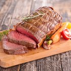 Fresh raw pork on cutting board on white background