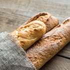 Sliced homemade French bread on sackcloth