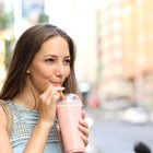 Freshly blended fruit smoothies of various colors and tastes