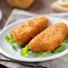 Fresh white fish fillets on chopping board