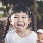 Little boy eating snacks from soft-sided insulated backpack