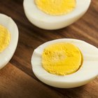 Boiled eggs on wooden background