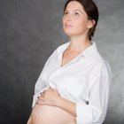 asian caucasian woman with pain in her stomcah