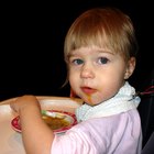 close-up of a baby girl sitting on a high chair