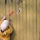 Baby boy (12-15 months) playing with abacus on ground