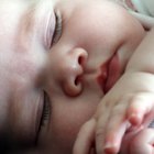 Newborn Girl Sleeping in Swaddle