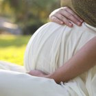 Pregnant woman discussing with female doctor