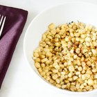 Grilled corn cobs on wooden background