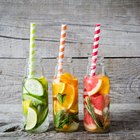 lemonade with fresh slice lemon on wooden background