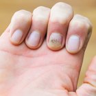 Young woman making manicure in beauty parlour, elevated view