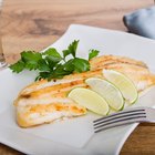 Fresh tilapia fillets with oil and lemon