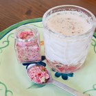 Walnut ice cream scoop in porcelain bowl