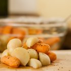 Plate with boiled potatoes on table