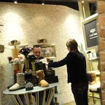 Eugene Gologursky/Getty Images Entertainment/Getty Images Shopper looking at Ugg boots in store