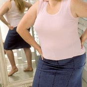 Excess back fat can make you feel self-conscious about your appearance.