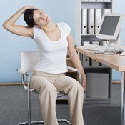 Stretching at your desk can energize you during work hours.