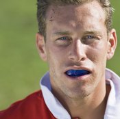 Mouth guards help spread the force of blows to the face to prevent the loss of teeth.