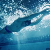 Lowering your head will reduce drag in the water, making you faster.
