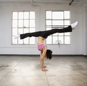 Master the handstand first and the split second.