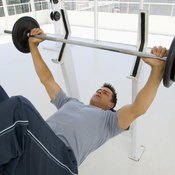 The bench press requires a barbell and a weight bench.