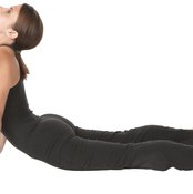 Yoga stretches and invigorates the body.