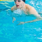 The swimmer's head remains above water with the breaststroke.