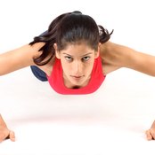 Pushups are one type of exercise that lift and tone the muscles behind your breasts.