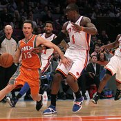 Tim Nash of the Phoenix Suns carries the ball in the frontcourt.