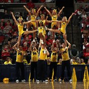 Male cheerleaders are often tasked with supporting their fellow cheerleaders, which requires ample strength.